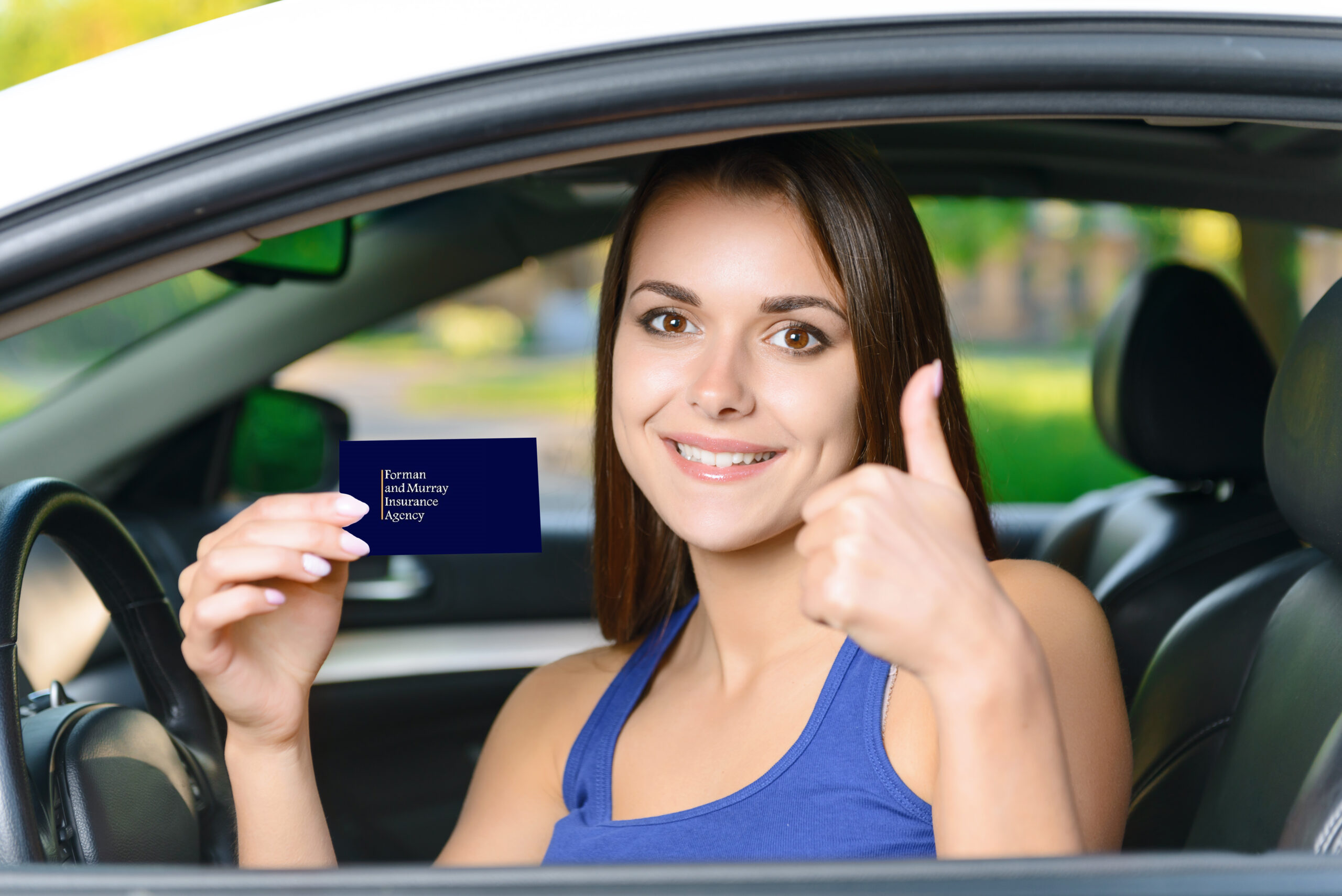 Girl in car with thumb up